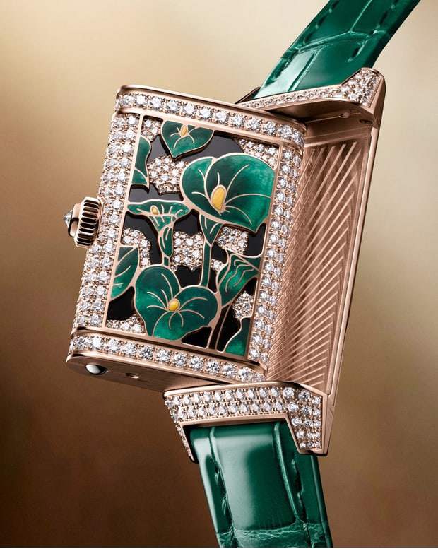 Jaeger-LeCoultre Luxury watch with green floral design and diamond accents on a gold background