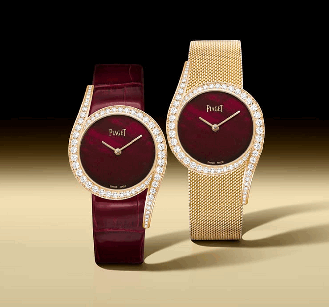 Two Piaget watches, one with a red face and burgundy strap, the other with a gold mesh band and red face, on a gradient background.